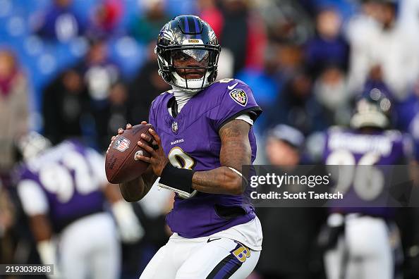Lamar Jackson of the Baltimore Ravens attempts a pass before the game ...