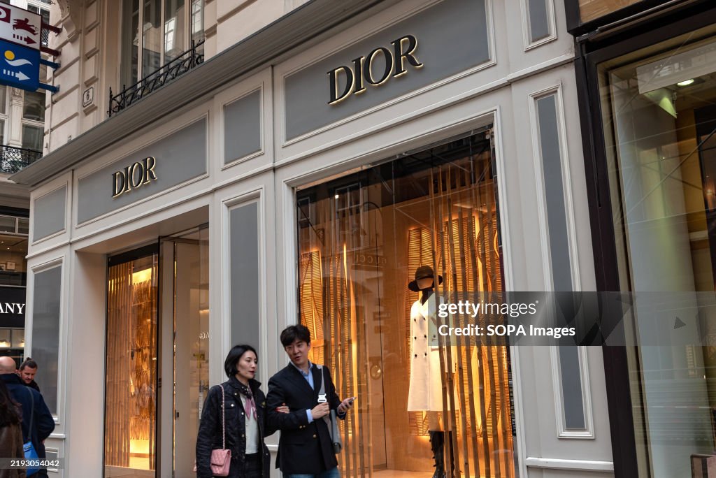 Shoppers outside Dior shop, luxury fashion brand in central...