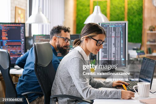Couple, software engineer developer use computer, work on program coding together at the office. Programming language development technology, freelance job concept Couple, software engineer developer use computer, work on program coding together at the office. Programming language development technology, freelance job concept