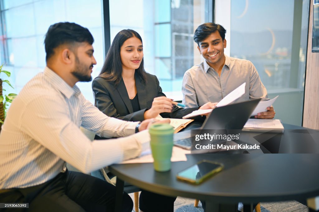 Young business professionals collaborating in a modern meeting room