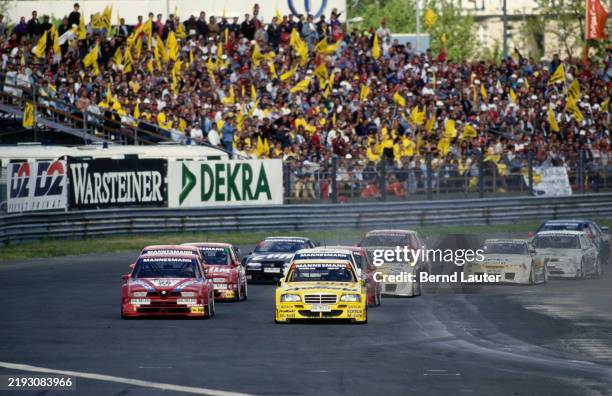 Jörg van Ommen from Germany drives the AMG-Mercedes Mercedes C-Class V6 alongside Giancarlo Fisichella from Italy driving the Alfa Corse 2 Alfa Romeo...