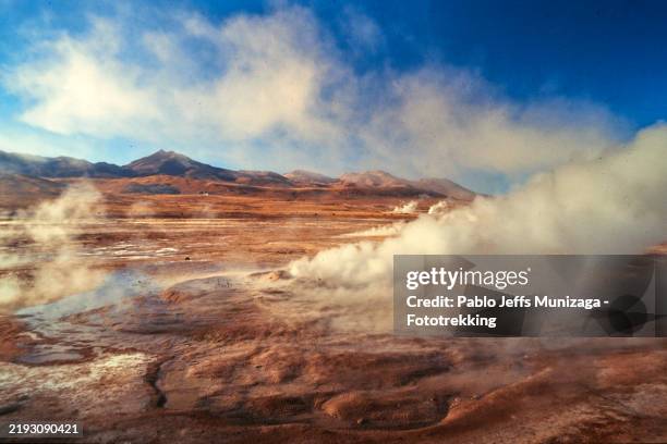 el tatio geysers emitting steam in the atacama desert, chile - atacama desert stock pictures, royalty-free photos & images