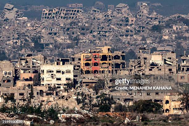 This picture taken from the Israeli side of the border with the Gaza Strip shows destroyed buildings in the northern Gaza Strip on January 13, 2025...