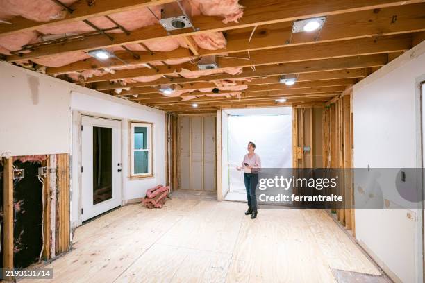 home owner supervising home renovation progress - incomplete stock pictures, royalty-free photos & images