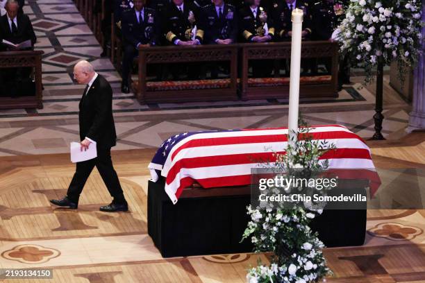 Stuart Eizenstat, advisor to former U.S. President Jimmy Carter, passes by Carter's flag-draped casket after speaking during his state funeral at...