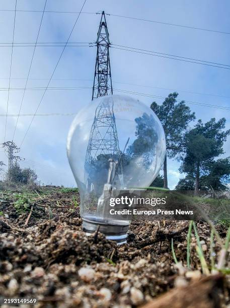 Light bulb stuck in the grass on January 9 in Madrid, Spain. The central government has definitively eliminated the temporary reductions that, since...