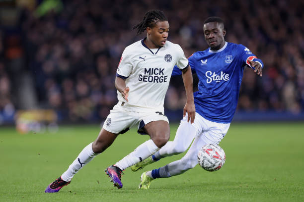 Ricky-Jade Jones of Peterborough United holds off a challenge from Idrissa Gueye of Everton during the Emirates FA Cup Third Round match between...