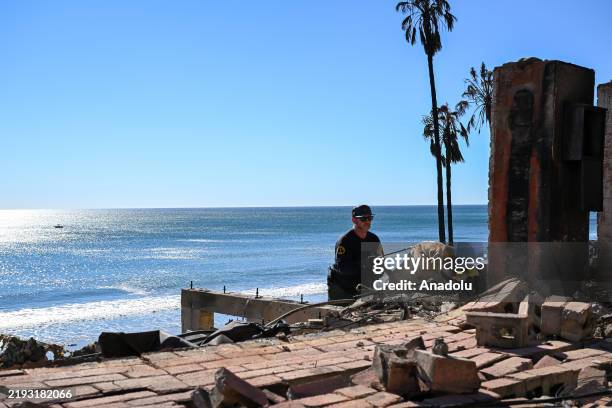 Unit from the Sheriff department searches for possible body remains in ashes of burned houses at Malibu Beach after 'Palisades Fire' in Los Angeles,...