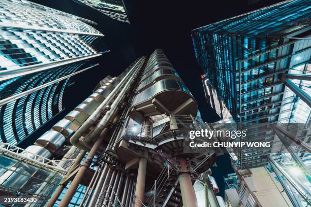 night time view up into the sky of the financial and business district in central city of london - steel pipes stock pictures, royalty-free photos & images