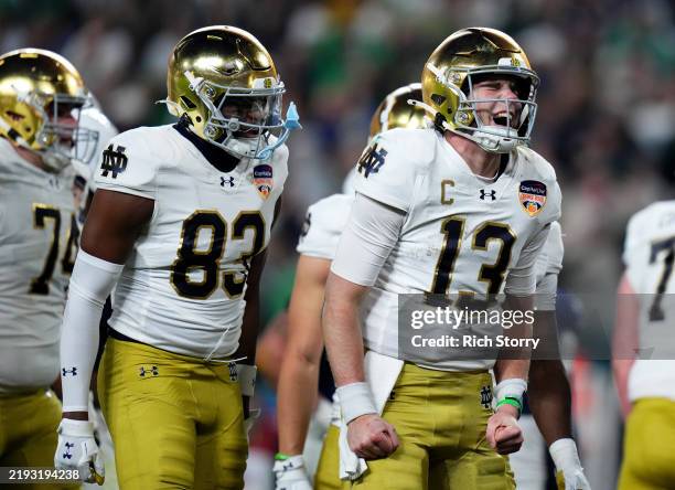 Riley Leonard of the Notre Dame Fighting Irish celebrates with teammates after running the ball for a touchdown during the third quarter against the...