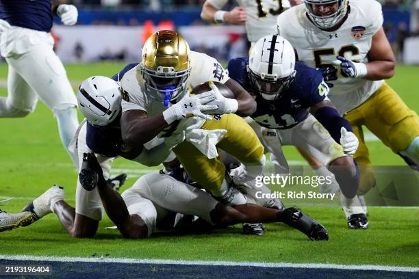 Jeremiyah Love of the Notre Dame Fighting Irish runs the ball for a touchdown during the fourth quarter against the Penn State Nittany Lions in the...