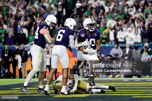 Nicholas Singleton of the Penn State Nittany Lions celebrates with teammates after running the ball for a touchdown during the fourth quarter against...