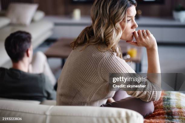 worried woman thinking of her problems at home. - skilsmässa bildbanksfoton och bilder