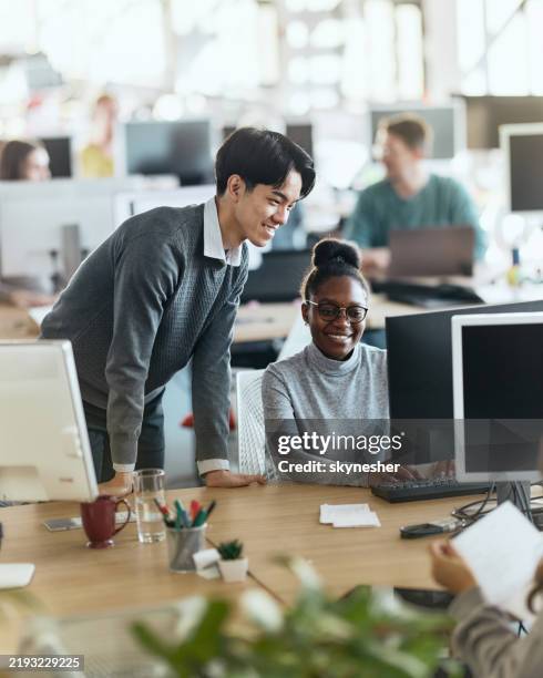 diverse programmers working on desktop pc in the office. - it professional stock pictures, royalty-free photos & images