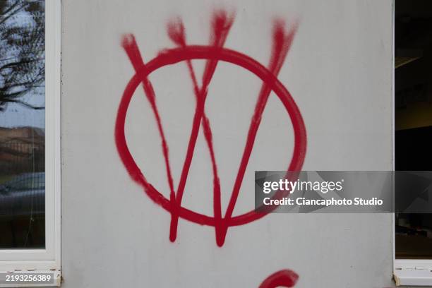 Spray-painted writings against covid-19 vaccinations, against the Italian IT-Wallet digital entity system, against the World Health Organization...