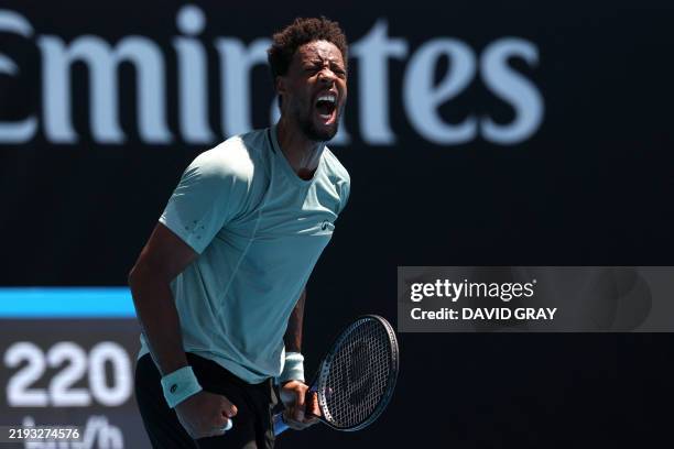 France's Gael Monfils reacts on a point against compatriot Giovanni Mpetshi Perricard during their men's singles match on day three of the Australian...