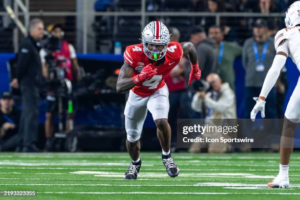 Ohio State Buckeyes wide receiver Jeremiah Smith runs up field during the CFP Semifinal Cotton Bowl Classic football game between the Ohio State...