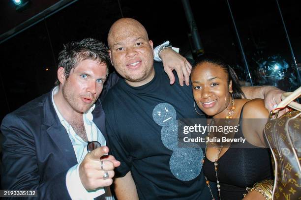 Publicist Gabe Tesoriero and record executives Shawn "Pecas" Costner and Ashaunna Ayars attend Young Jeezy's album release party at Visions Nightclub...