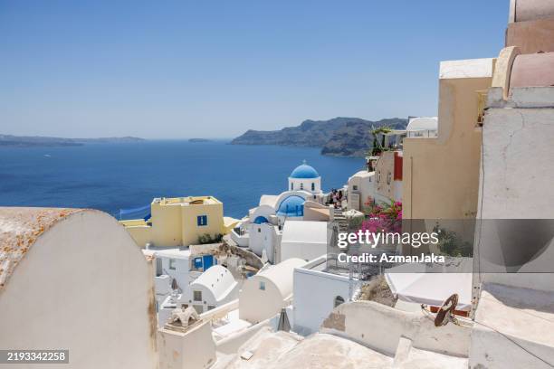 santorini island view with blue domes in summer - mediterranean-blue-roof-santorini stock pictures, royalty-free photos & images