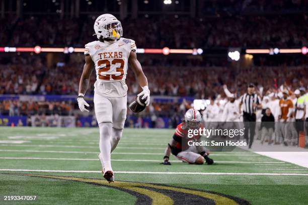 Jaydon Blue of the Texas Longhorns scores a touchdown in the third quarter against the Ohio State Buckeyes during the Goodyear Cotton Bowl at AT&T...