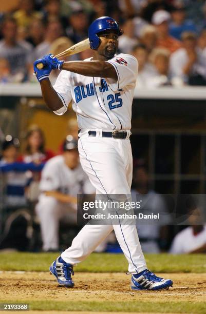 American League All-Star first baseman Carlos Delgado of the Toronto Blue Jays swings at an National League All-Star pitch during the 74th Major...