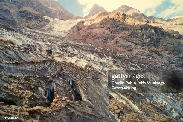 melting glacier reveals rocky landscape in the andes mountains - permafrost stock pictures, royalty-free photos & images