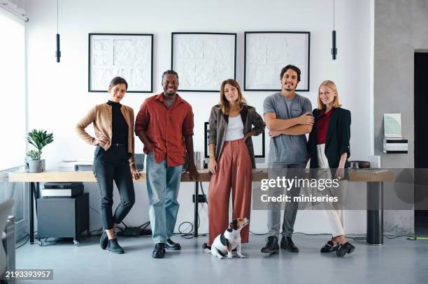 professional team posing together in a modern office setting - neurodiversity stock pictures, royalty-free photos & images