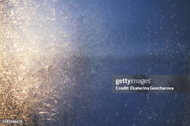 abstract textured pattern with shimmering light reflections and soft gradient tones - light leak stock pictures, royalty-free photos & images