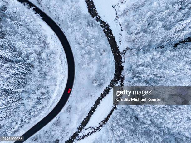 aerial view on winter landscape with a road beside a river - parallel stock pictures, royalty-free photos & images
