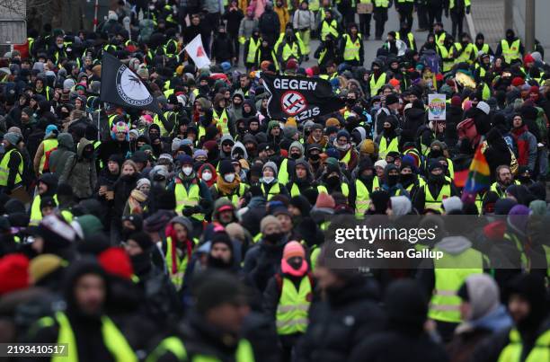 Protesters gather outside the venue where the far-right Alternative for Germany political party was holding its party congress on January 11, 2025 in...