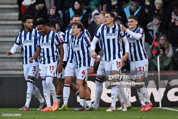 Caleb Taylor of West Bromwich Albion celebrates scoring his team's first goal with teammates during the Emirates FA Cup Third Round match between AFC...