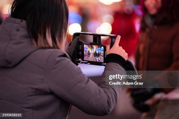 Members of the Studio1 dance group dance and record videos to be used for social media, including TikTok, in Times Square on January 14, 2025 in New...