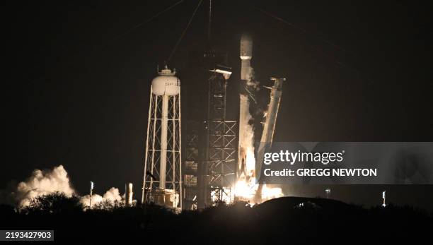 SpaceX Falcon 9 rocket, carrying Firefly Aerospace's Blue Ghost and ispace's Resilience lunar landers, lifts off from Launch Complex 39A at the...
