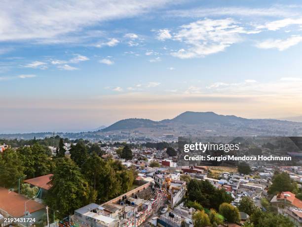 aerial view of sunrise above a small suburb of mexico city around ajusco park - mexico city, mexico - mountain ridge stock pictures, royalty-free photos & images