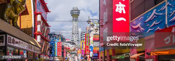 osaka tsutenkaku tower overlooking colorful shinsekai restaurants panorama japan - osaka prefecture stock pictures, royalty-free photos & images