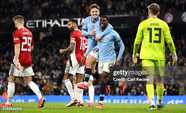 Divin Mubama of Manchester City celebrates scoring his team's second goal with teammate James McAtee during the Emirates FA Cup Third Round match...