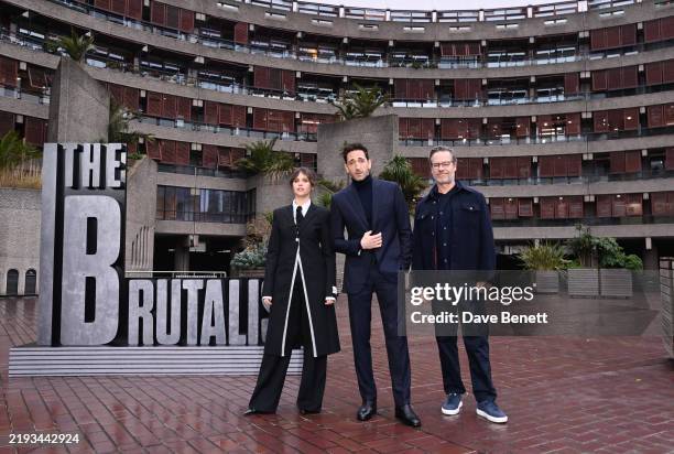 Felicity Jones, Adrien Brody and Guy Pearce attend the London photocall for "The Brutalist" at Brutalist landmark The Barbican on January 15, 2025 in...