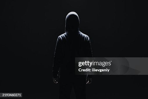Silhouette of man in hood Silhouette of man in hood