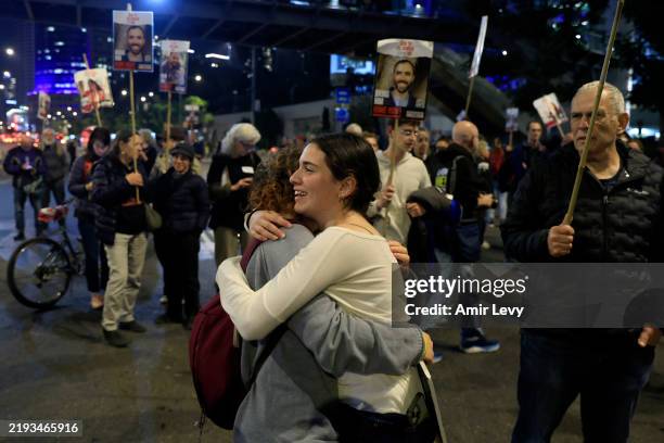 People react to the reports of a possible Gaza cease fire and hostage release deal being reached during a rally calling for the return of hostages...