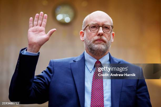 President-elect Donald Trump's nominee for Office of Management and Budget Director Russell Vought is sworn in for a Senate Homeland Security and...