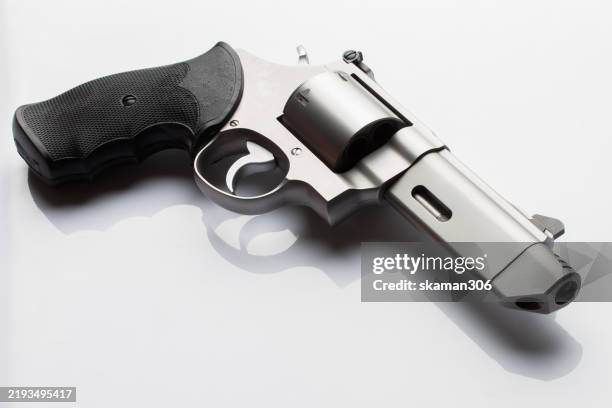 close up handgun on white background isolate - revolver-with-silencer stock-fotos und bilder