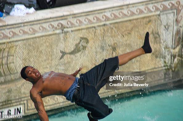 Sitting By Pool Rapper Rapper Lil Scrappy jumps into the pool during an MTV pool party on ...