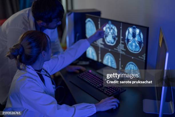 doctor analyzing data . - brain character stock pictures, royalty-free photos & images