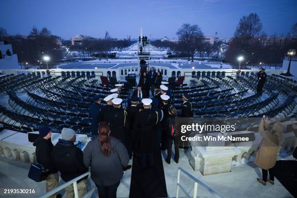 Members of the military confer on stage prior to the start of a rehearsal for the presidential inauguration at the U.S. Capitol on January 12, 2025...