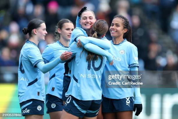 Laura Coombs of Manchester City celebrates scoring her team's second goal with teammates during The Adobe Women's FA Cup Fourth Round match between...