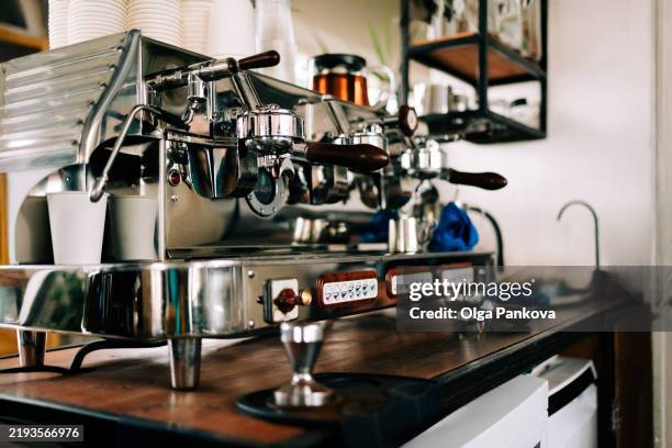 professional espresso machine on wooden countertop in coffee shop - macchina per il caffè foto e immagini stock