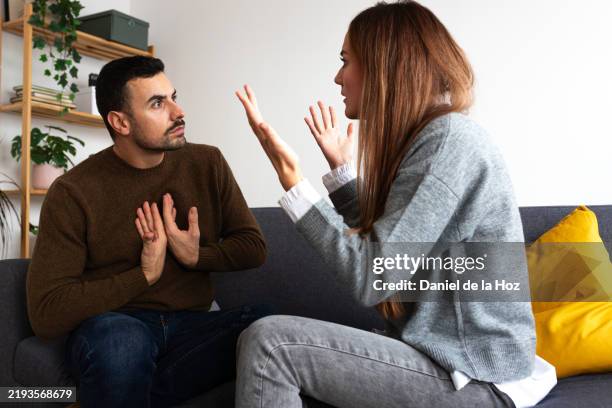 young couple having an argument. woman is angry with man. - wife stock pictures, royalty-free photos & images
