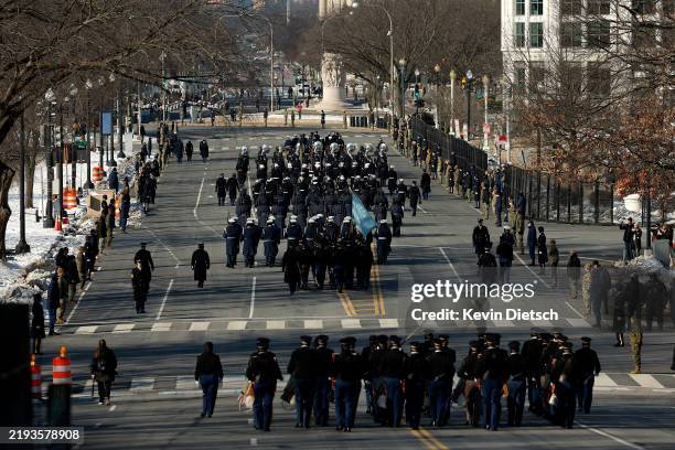 Military unites and marching bands march the parade route during an inauguration rehearsal in Lafayette Park on January 12, 2025 in Washington, DC....