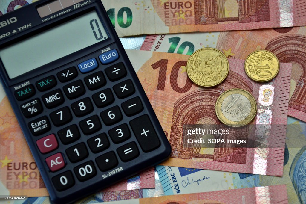 In this photo illustration, a calculator seen on euro...