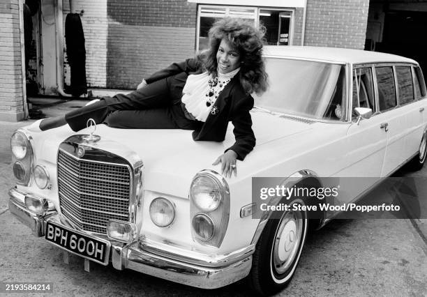 American singer Mary Wilson of The Supremes photographed with the Mercedes-Benz 600 Pullman she bought from The Beatles' George Harrison, which was...